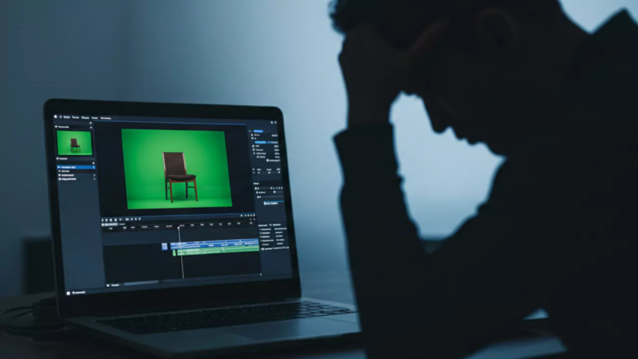 frustrated editor while editing greenscreen footage